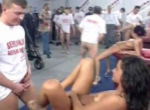 Public sex orgy with regard to hot babes in a huge warehouse