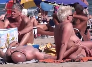 Sexual congress on someone's extrinsic nudist beach