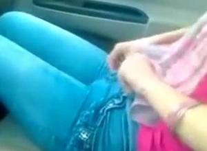 Toothsome Girlfriend Removing Jeans In Passenger car